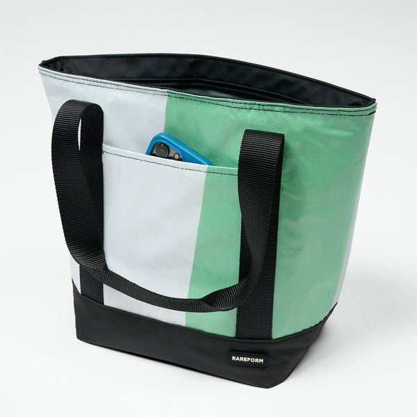 Waterproof cooler pool bag in a green and white billboard print