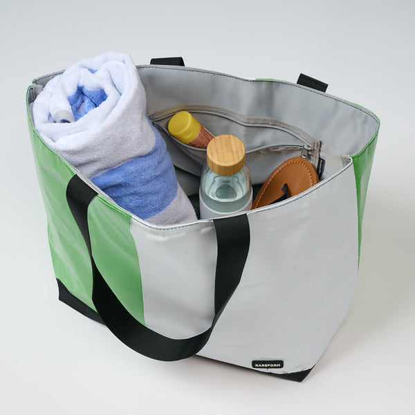 Best beach tote packed with towels and beach essentials for a family beach day