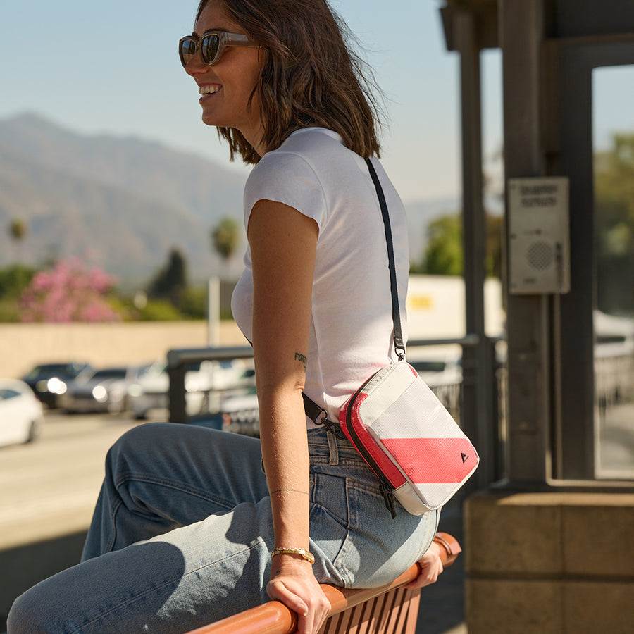 Woman wearing the sling bag crossbody, one of the trendy beach bags for summer