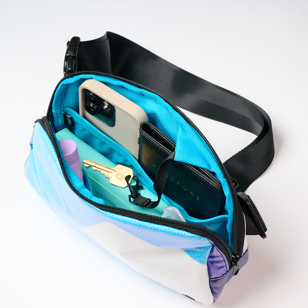 Trendy sling beach bag holding phone, keys and essentials